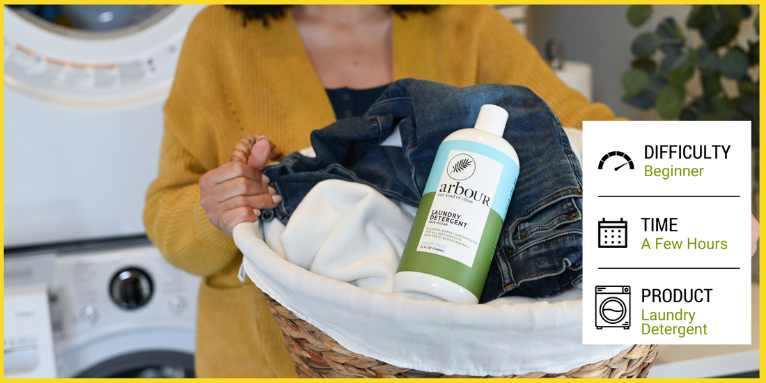 Woman with laundry basket of clothes and arbOUR laundry detergent
